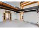 Spacious living area with wooden beam accents and neutral carpet at 135 Poorman Rd Rd, Boulder, CO 80302