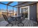 Cozy back deck with dining table and chairs at 8653 Red Clover Ct, Parker, CO 80134