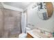 Bathroom featuring tiled shower and vanity with decor at 8653 Red Clover Ct, Parker, CO 80134