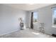 Bright bedroom featuring natural light and neutral walls and carpet at 8653 Red Clover Ct, Parker, CO 80134