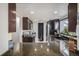 Well-equipped kitchen with stainless steel appliances, granite countertops, and dark wood cabinetry at 8653 Red Clover Ct, Parker, CO 80134