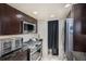 Updated kitchen with stainless steel appliances including gas range, built-in microwave, and ample cabinet space at 8653 Red Clover Ct, Parker, CO 80134