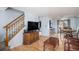 Inviting living room featuring hardwood floors, a staircase, and sliding door to the backyard at 8653 Red Clover Ct, Parker, CO 80134