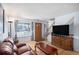Inviting living room featuring hardwood floors, a staircase, and bright window at 8653 Red Clover Ct, Parker, CO 80134