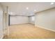 Expansive finished basement features recessed lighting and soft carpet flooring at 14000 Winding River Ct # T3, Broomfield, CO 80023