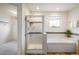 Well-lit bathroom featuring a tiled shower, soaking tub, and access to a walk-in closet at 14000 Winding River Ct # T3, Broomfield, CO 80023
