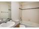 This full bathroom is clean with a shower over the tub, neutral tile, and vanity at 14000 Winding River Ct # T3, Broomfield, CO 80023