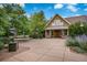 Beautiful clubhouse with well-kept landscaping, a statue, and double doors at 14000 Winding River Ct # T3, Broomfield, CO 80023