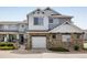 Lovely townhome with attached garage, stone accents, neutral siding and well maintained landscaping at 14000 Winding River Ct # T3, Broomfield, CO 80023