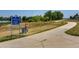 Scenic view of the paved 'Lake Link Trail' walking path near the property with lush greenery and trees at 14000 Winding River Ct # T3, Broomfield, CO 80023