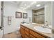 Bathroom with double sinks and granite countertops and walk in shower at 9714 Chanteclair Cir, Highlands Ranch, CO 80126