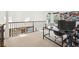 Second story loft space being used as home office with views to the downstairs at 9714 Chanteclair Cir, Highlands Ranch, CO 80126