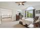Main bedroom featuring carpet floor, ceiling fan and a walk out to the balcony at 9714 Chanteclair Cir, Highlands Ranch, CO 80126