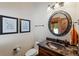 Bathroom with vanity, round mirror and toilet at 378 Juniata Cir, Breckenridge, CO 80424