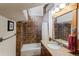 Cozy bathroom with tiled walls, shower-tub combo, and vanity with granite countertop at 378 Juniata Cir, Breckenridge, CO 80424