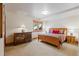 Comfortable bedroom with wood accents, dresser, lamps, and bedside tables with views at 378 Juniata Cir, Breckenridge, CO 80424