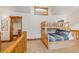 Cozy loft-style bedroom featuring wood frame bunkbeds, natural light, and a built-in access ladder at 378 Juniata Cir, Breckenridge, CO 80424