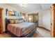 Comfortable bedroom features a king-sized bed, ensuite bathroom access, closet storage, and private patio entrance at 378 Juniata Cir, Breckenridge, CO 80424