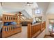 Fun bedroom features a wood frame bunk bed, a comfortable seating area, and views from the cozy loft at 378 Juniata Cir, Breckenridge, CO 80424
