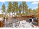 Outdoor deck with seating and views of surrounding trees at 378 Juniata Cir, Breckenridge, CO 80424