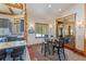 Charming dining area features a table with seating for four, hardwood floors, and an entrance to outdoor patio seating at 378 Juniata Cir, Breckenridge, CO 80424