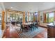 Dining room with rustic wooden furniture and a decorative area rug and views to living room at 378 Juniata Cir, Breckenridge, CO 80424