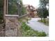 The well-maintained property has stone pillars, a paved drive and charming wooden accents at 378 Juniata Cir, Breckenridge, CO 80424