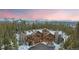 Stunning mountain home with snow-capped peaks, log accents, and a picturesque wooded setting at 378 Juniata Cir, Breckenridge, CO 80424