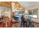 Open-concept kitchen features a large center island with seating, custom cabinets, and hardwood flooring with access to dining area at 378 Juniata Cir, Breckenridge, CO 80424