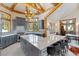 Spacious kitchen featuring a large island, gray cabinets, and wood beam accents at 378 Juniata Cir, Breckenridge, CO 80424