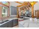 Bright kitchen featuring an island, stone backsplash, and seamless views into the living area at 378 Juniata Cir, Breckenridge, CO 80424