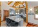 Stylish kitchen with a large island, stainless steel appliances, and exposed wood beams at 378 Juniata Cir, Breckenridge, CO 80424