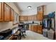 Well-lit laundry room offers ample storage with wood cabinets, a sink, and adjacent desk, combining functionality and workspace at 378 Juniata Cir, Breckenridge, CO 80424