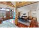 Inviting living space featuring wood floors, exposed beams, and an open layout to the dining area at 378 Juniata Cir, Breckenridge, CO 80424