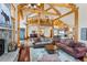 Open-concept living area with exposed beams, seamlessly connected to the kitchen and dining spaces at 378 Juniata Cir, Breckenridge, CO 80424