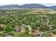 Aerial view of a neighborhood showcasing lush greenery and mountain views at 40 S 34Th St, Boulder, CO 80305