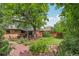 Expansive backyard with a covered patio, mature trees, and beautiful landscaping at 40 S 34Th St, Boulder, CO 80305