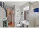 Bathroom features a toilet, a pedestal sink, shower over tub and extra storage at 40 S 34Th St, Boulder, CO 80305
