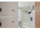 Traditional bathroom showcasing a tub with shower, storage and a white sink at 40 S 34Th St, Boulder, CO 80305