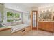 Bright bathroom with soaking tub under a window with beautiful backyard view at 40 S 34Th St, Boulder, CO 80305