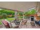 Cozy outdoor patio with brick floor, furniture, string lights, and lush garden at 40 S 34Th St, Boulder, CO 80305