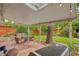 Covered patio area with brick floor, outdoor seating and landscaping at 40 S 34Th St, Boulder, CO 80305