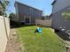 Well-manicured backyard with a slide and privacy fence, perfect for entertaining or relaxation at 20017 E 48Th Pl, Denver, CO 80249