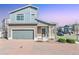 Inviting two-story home with a two car garage, brick driveway, and well-maintained landscaping at 20017 E 48Th Pl, Denver, CO 80249