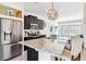 Spacious kitchen island with granite countertops and modern stainless steel appliances at 20017 E 48Th Pl, Denver, CO 80249