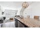 Bright open-concept, seamlessly connects the kitchen and living space for easy entertaining and relaxed living at 20017 E 48Th Pl, Denver, CO 80249