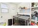 Well-organized laundry room with modern washer and dryer, plus ample storage at 20017 E 48Th Pl, Denver, CO 80249
