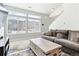 Comfortable living area filled with natural light, a large sectional couch, and open staircase access at 20017 E 48Th Pl, Denver, CO 80249