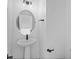Powder room showcasing a pedestal sink, modern faucet, a decorative oval mirror and contemporary design at 2078 S Holly St # 3, Denver, CO 80222