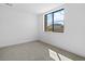 Bedroom featuring carpeted flooring and a large window that offers natural light and outside views at 2078 S Holly St # 3, Denver, CO 80222